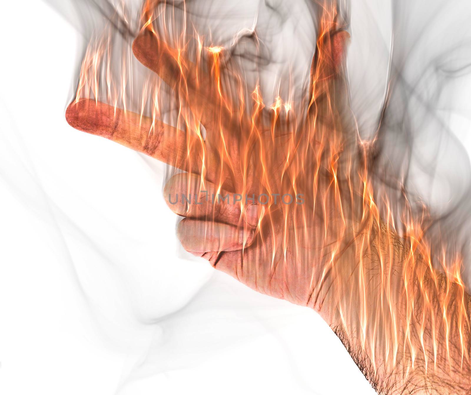 A human hand on fire burning with orange flames and some smoke in front of a white background