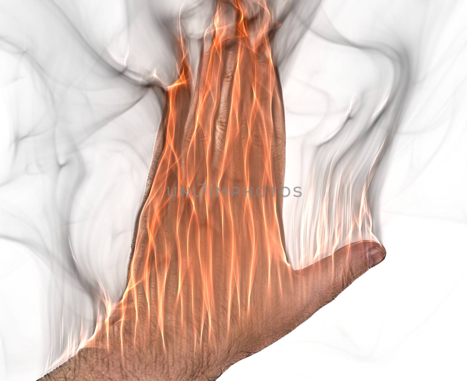 A human hand on fire burning with orange flames and some smoke in front of a white background