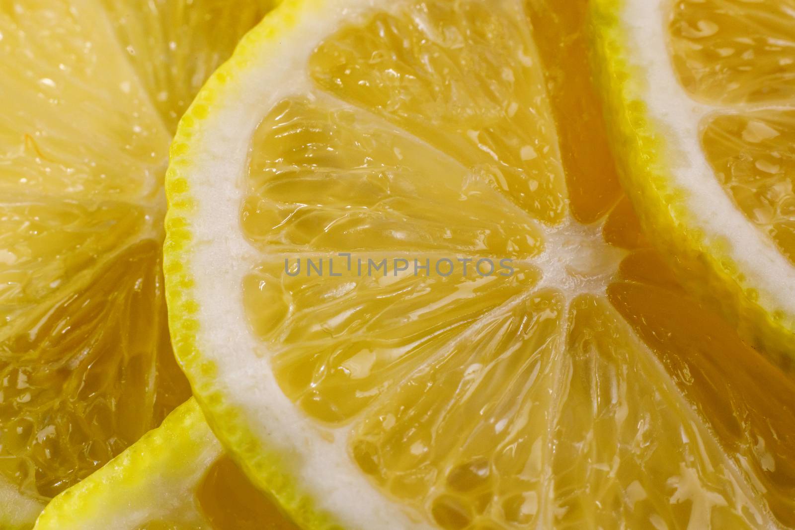 Lemon background. Close up view of lemon slices. Citrus texture. by 9parusnikov