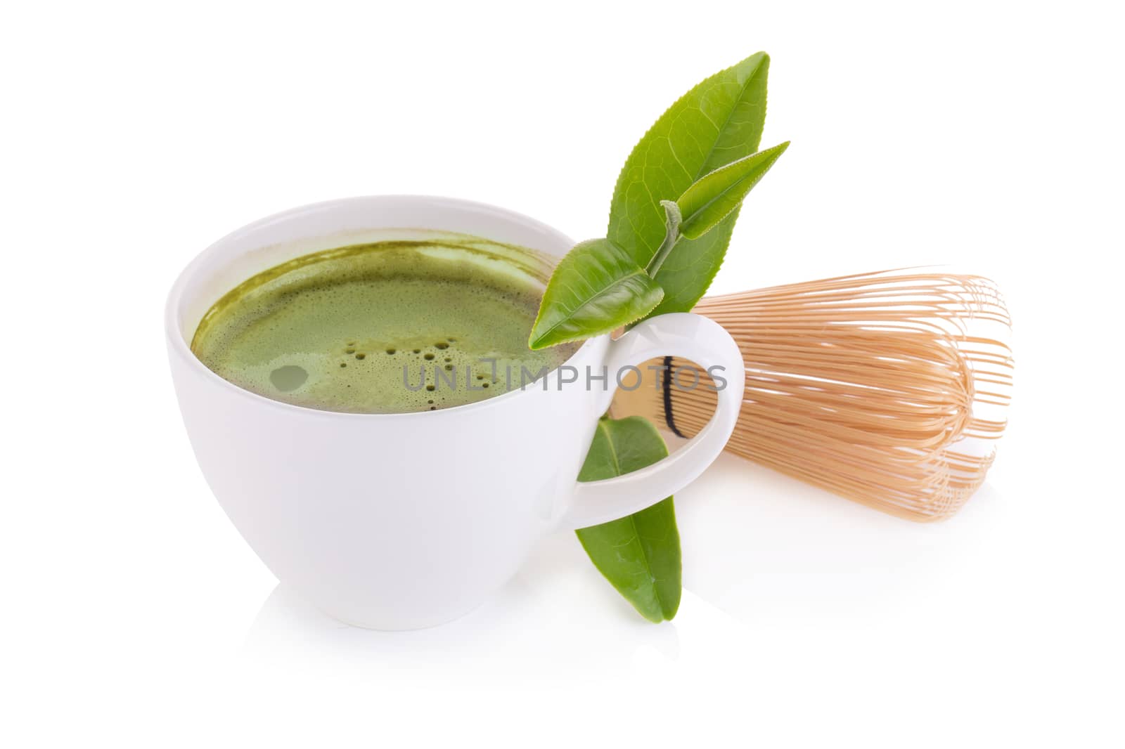 matcha powder in White ceramic spoon and Green tea matcha latte cup isolated on white background.