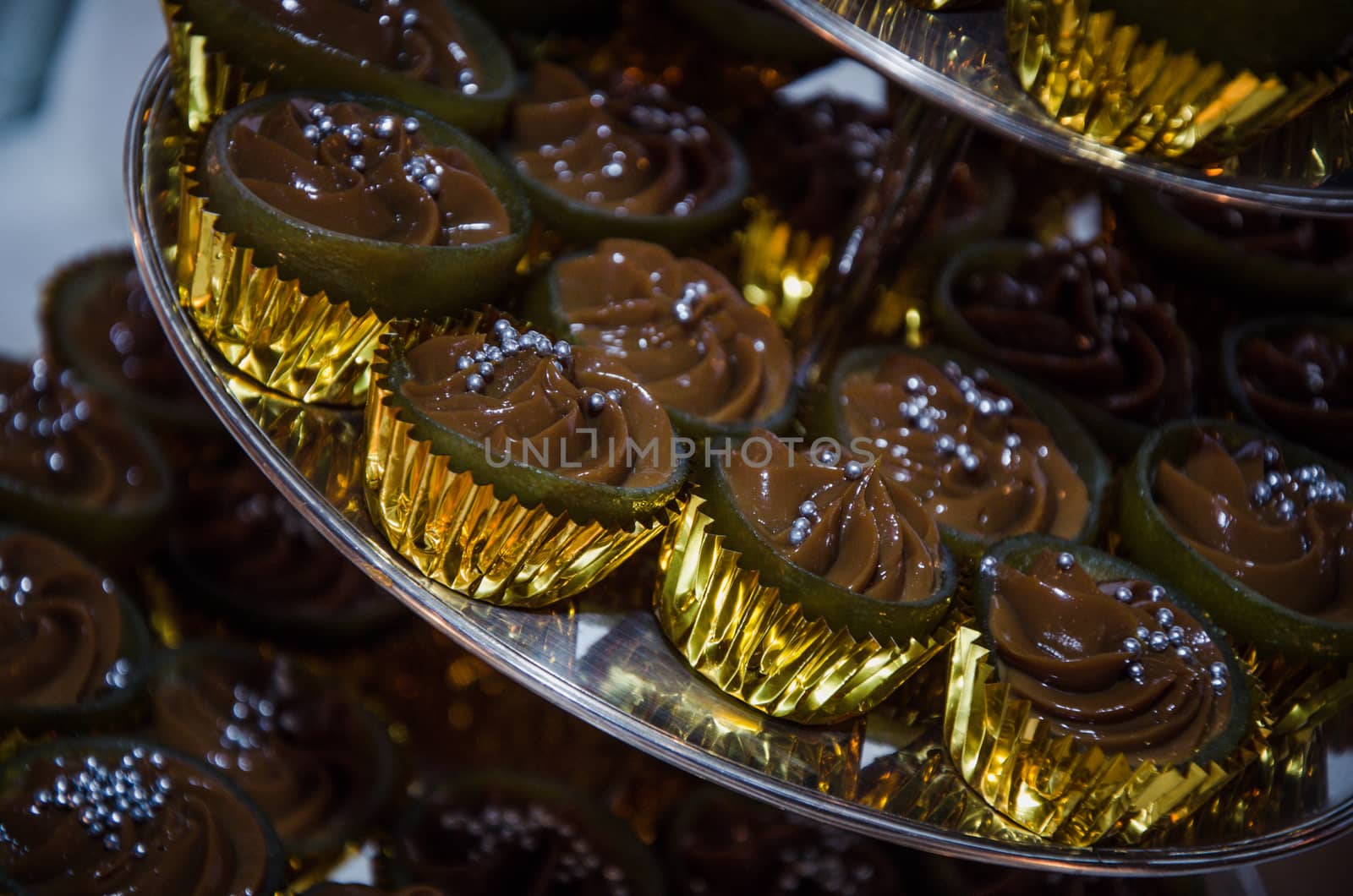 Mini chocolate cupcakes with silver candy balls