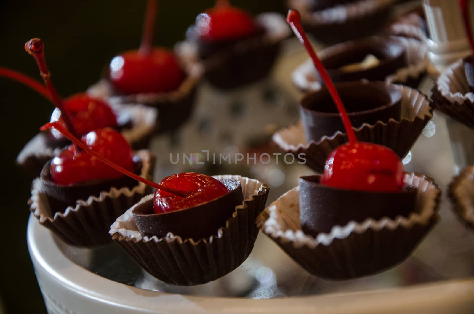 Decoration on a candy table with a cherry covered with chocolate