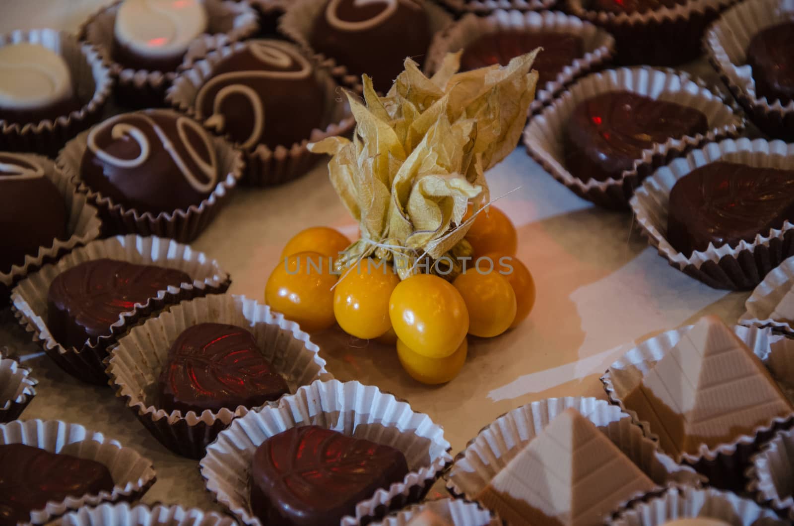 Chocolate sweets with small balls of Aguaymanto