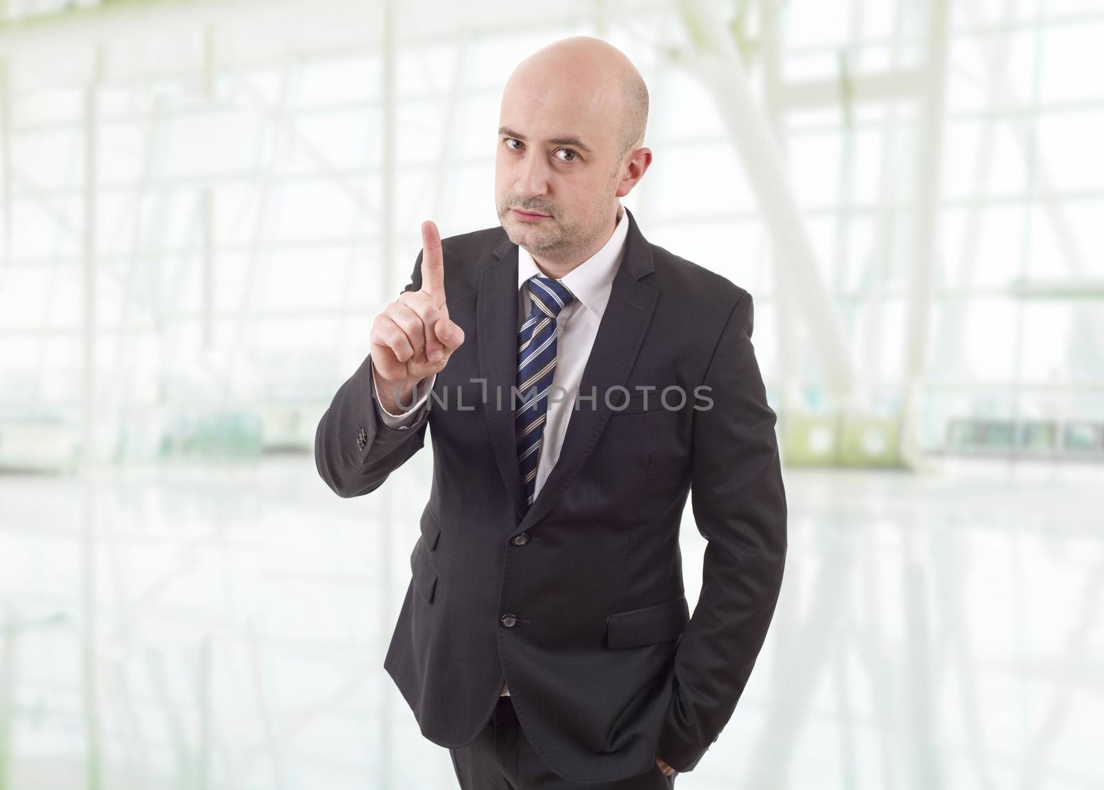 mad business man pointing, at the office