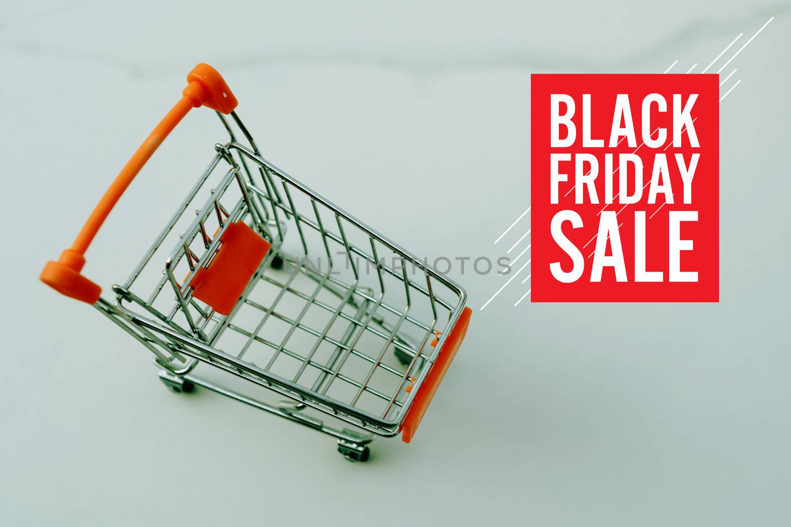 Shopping cart on marble white floor texture with black friday sale graphic design.  by Suwant