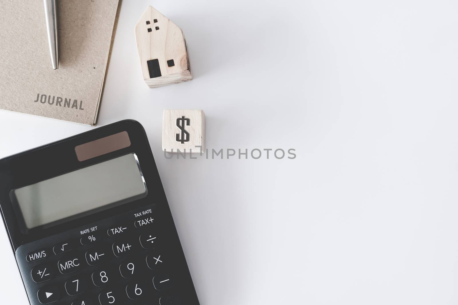 Top view of blank white copyspace with calculator, tiny home model, credit card and pen as frame background. Investing loan plan of money situation lifestyle concept. by Suwant