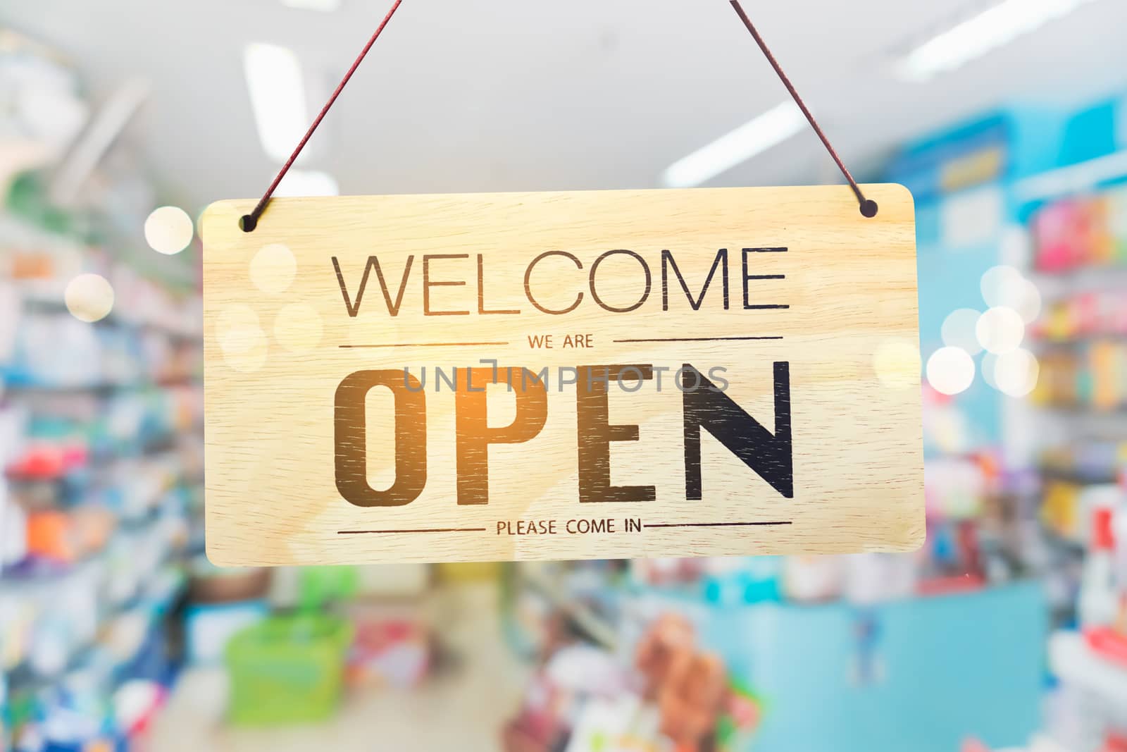 A business sign that says open on cafe or restaurant hang on door at entrance. Vintage color tone style.