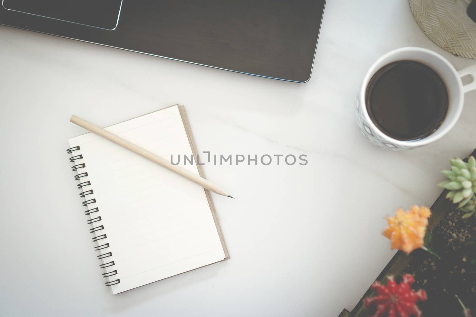 Blank white copyspace with on marble desk work space white tone color texture. by Suwant