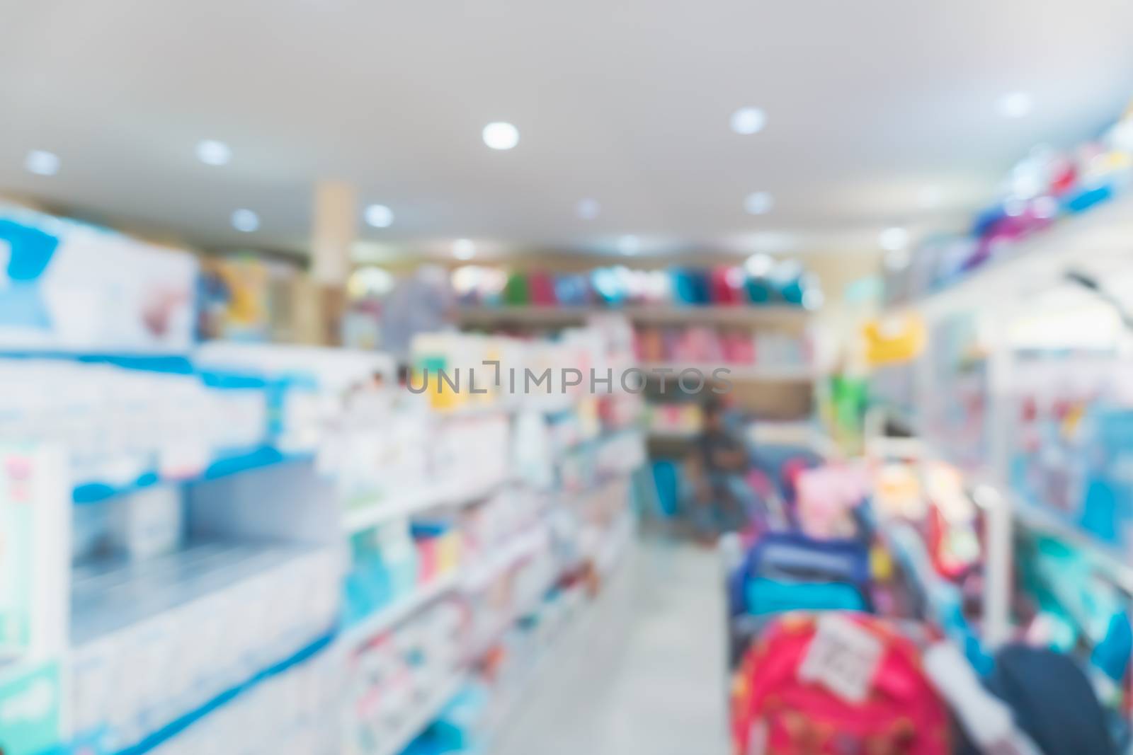 Blur modern baby and kid deparment  store shop bright tone abstract blurry background.