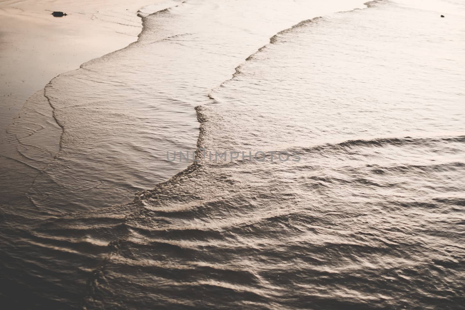 Tropical nature clean beach and white sand in summer season with dark color tone background. by Suwant