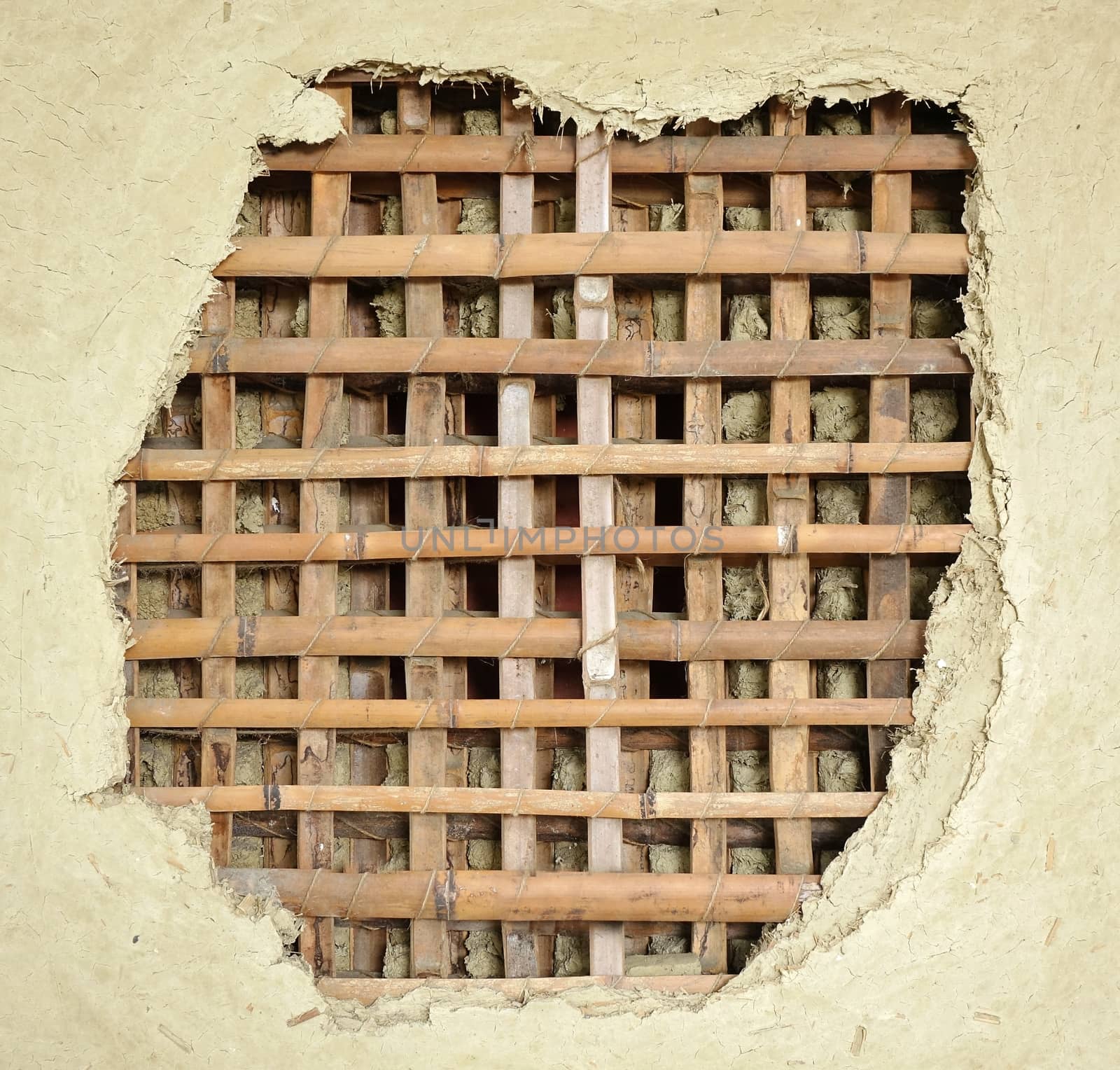 Traditional Chinese farm house wall made from bamboo slats and mud
