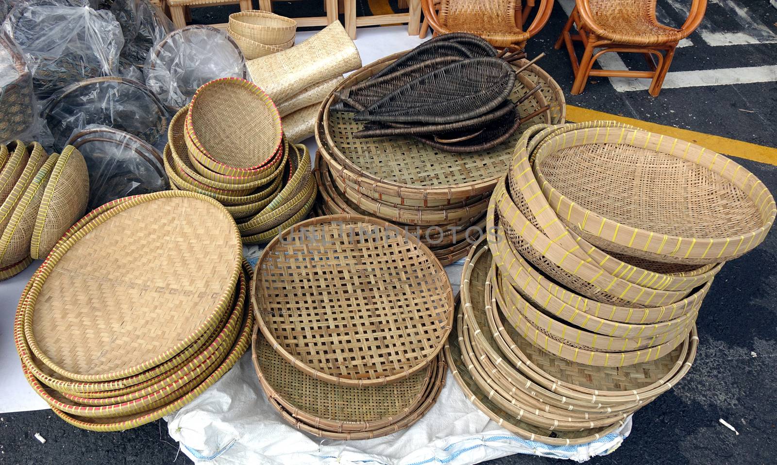 Handcrafted wicker baskets and trays at an outdoor market