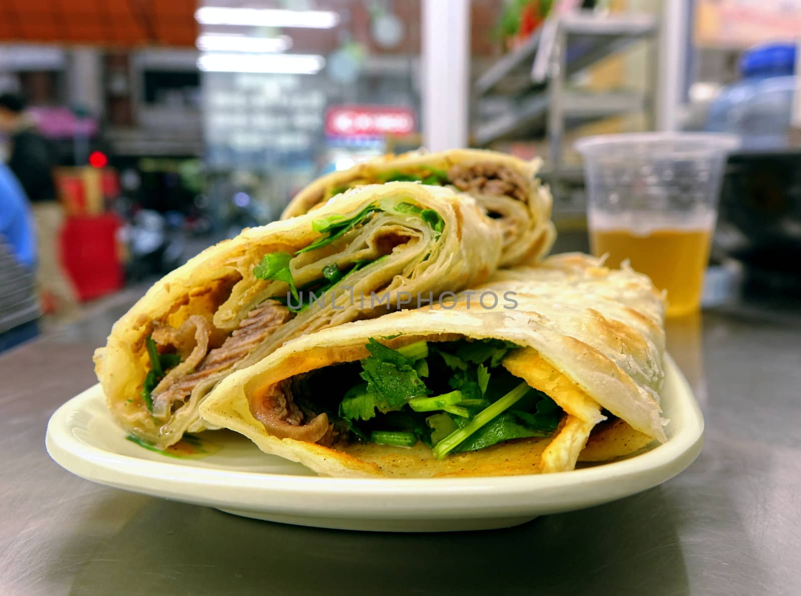 Rolled pancakes stuffed with beef, cilantro and sweet bean sauce are a popular Chinese snack