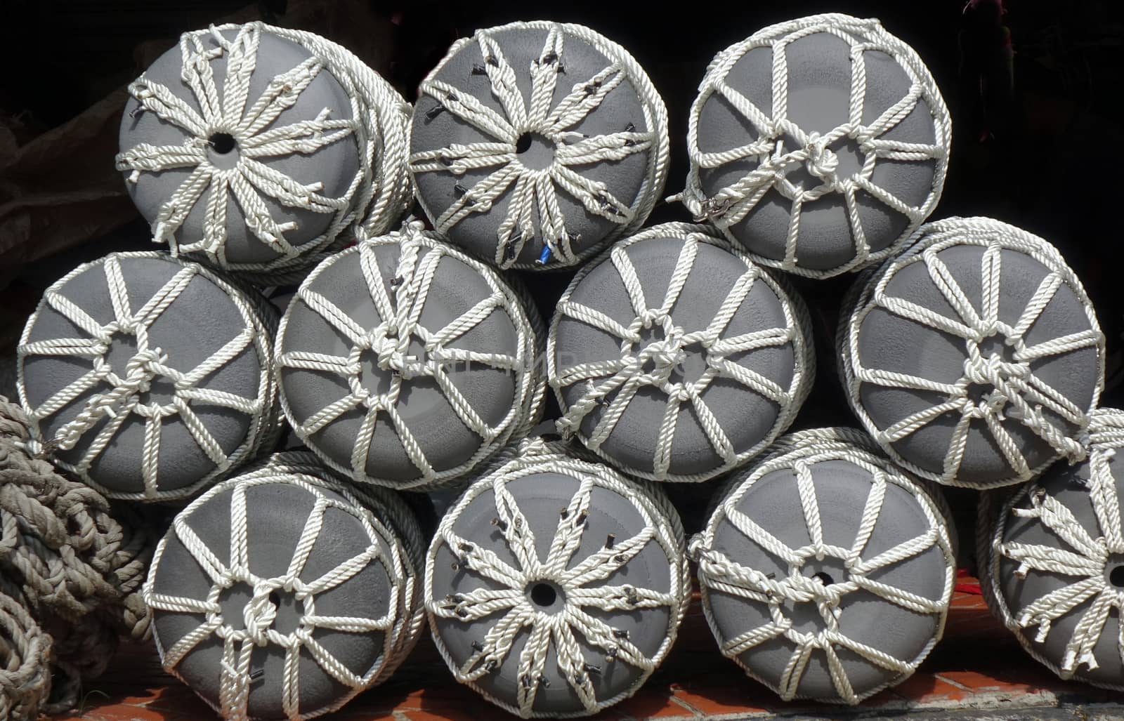 A store for boat supplies sells large fishing buoys with ropes
