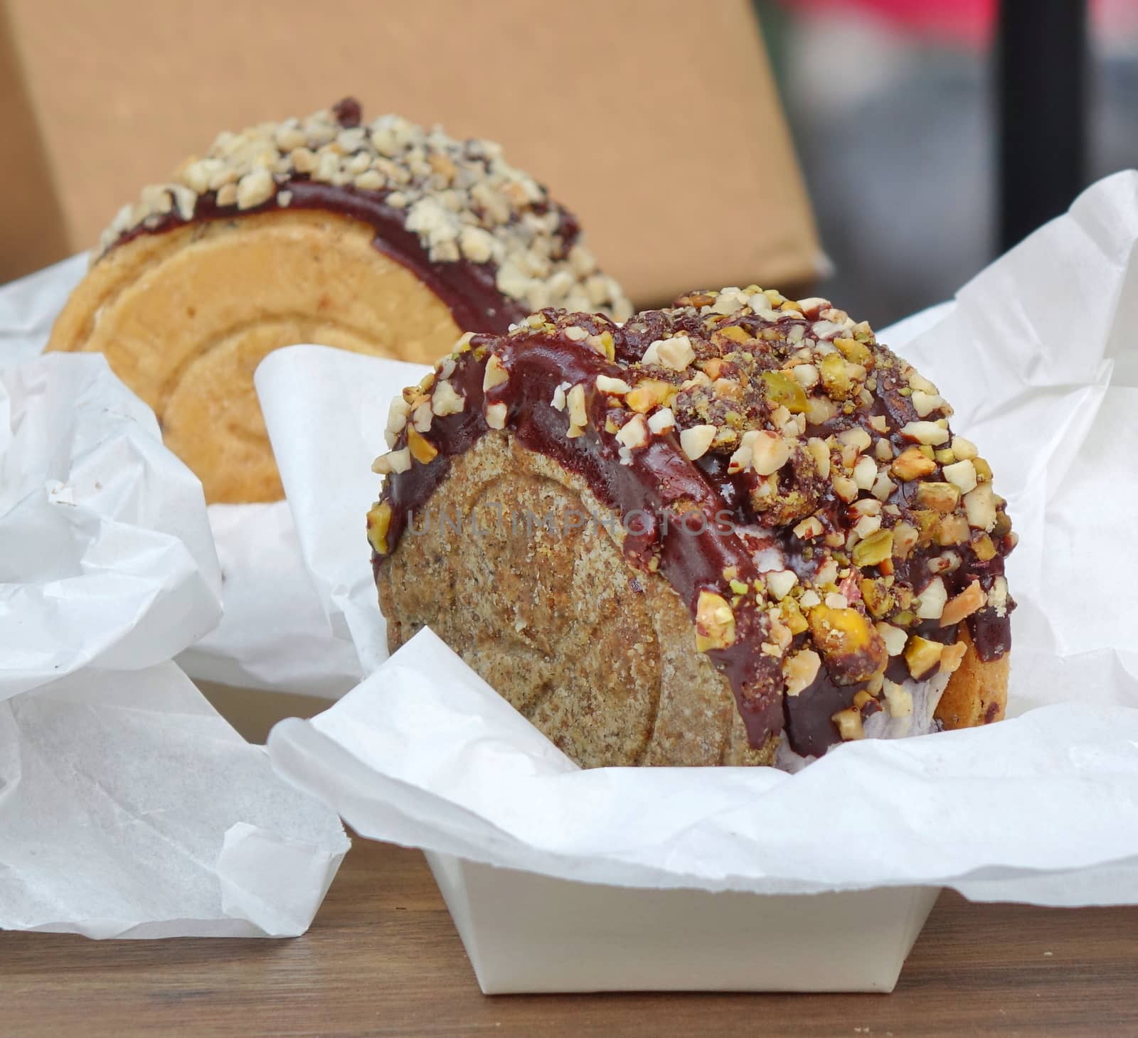 Delicious cake with chocolate glaze and nuts