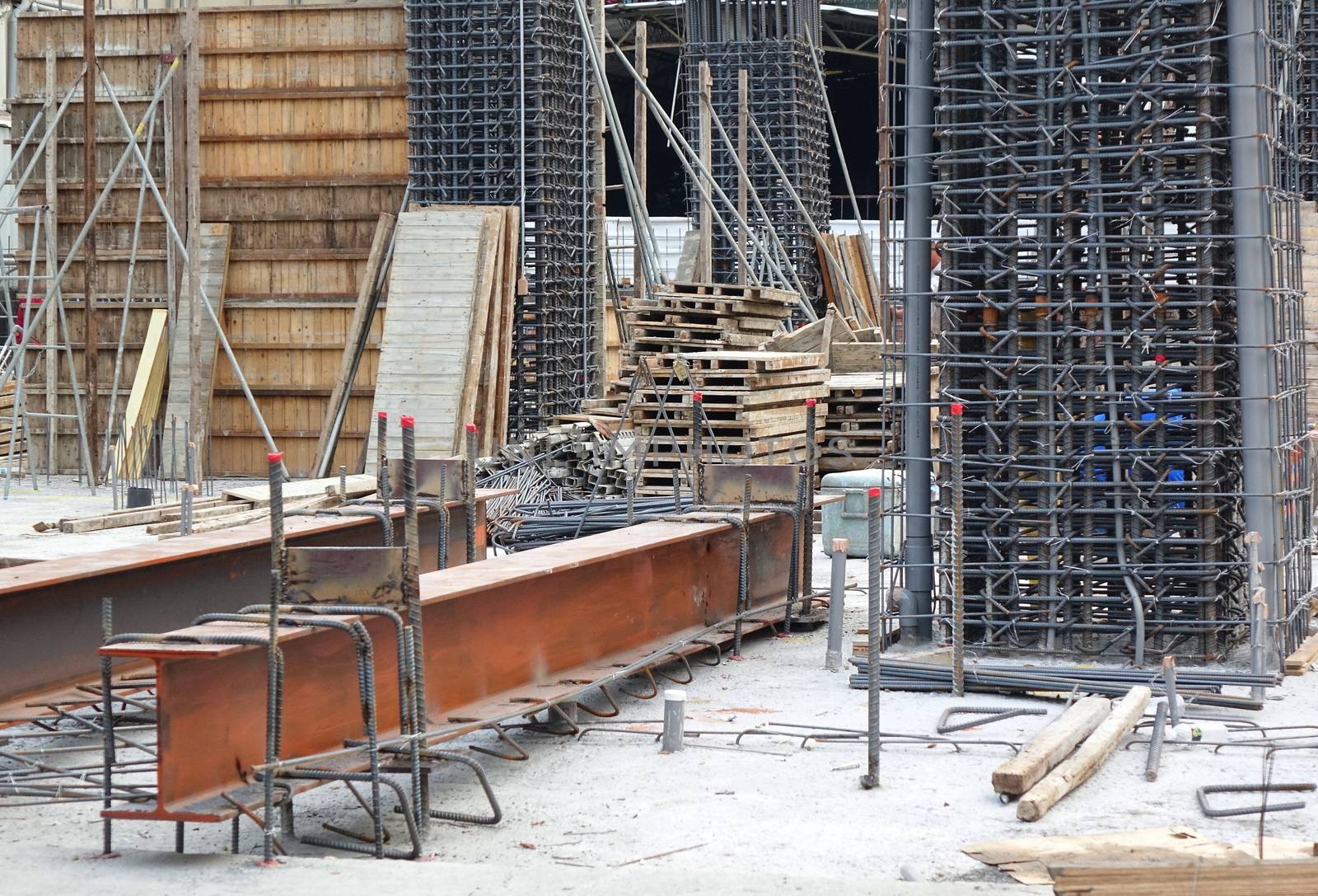 Construction site for new housing with steel girders and rebar
