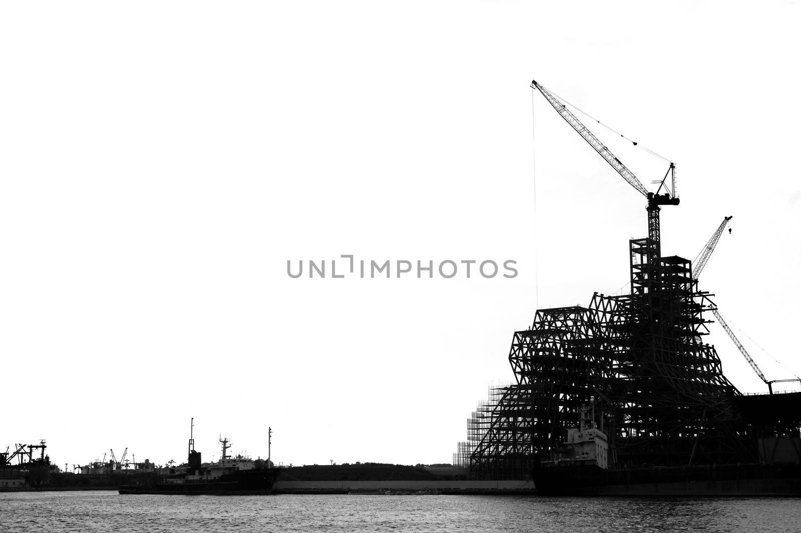 A large scale construction project seen as a silhouette
