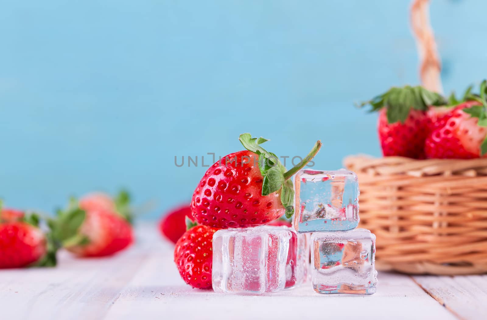 Three strawberries with strawberry leaf