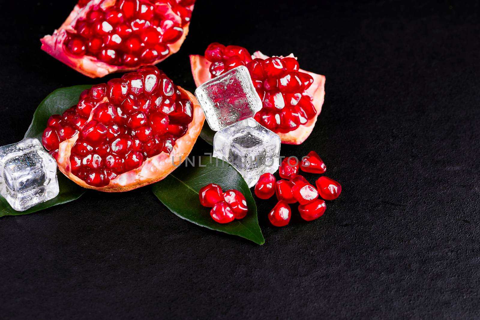 Ripe pomegranate fruits on the wooden background  by freedomnaruk