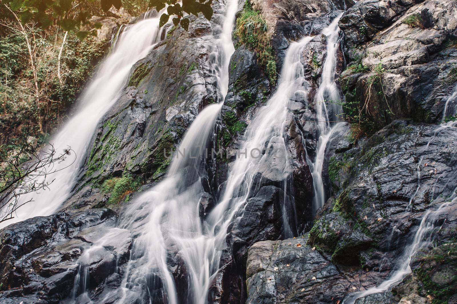 soft water of the stream in the natural park, Beautiful waterfall in rain forest