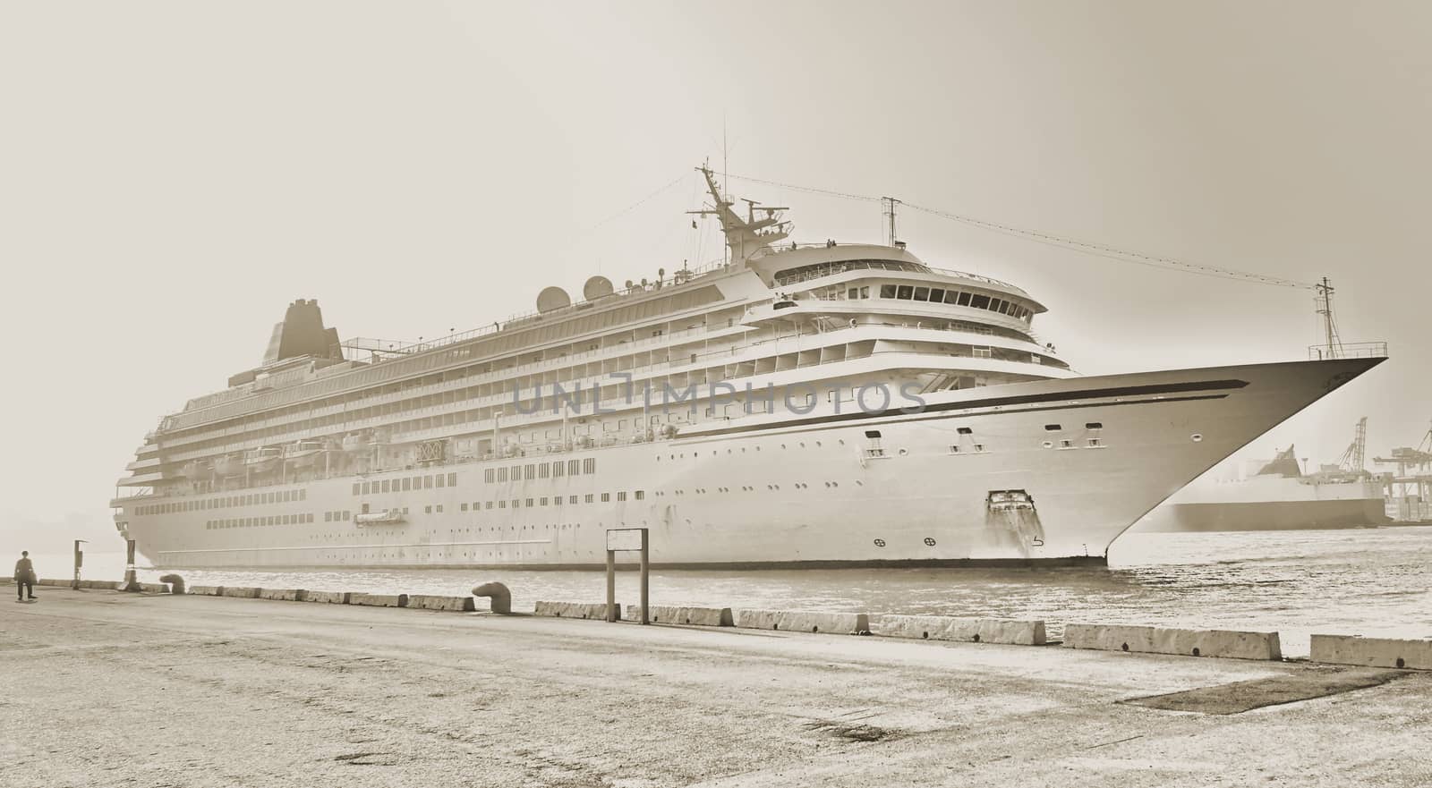 Vintage style image of a large cruise ship docking in port