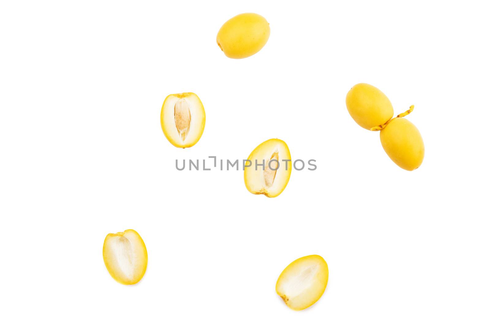 yellow date palm fruit on white background by freedomnaruk