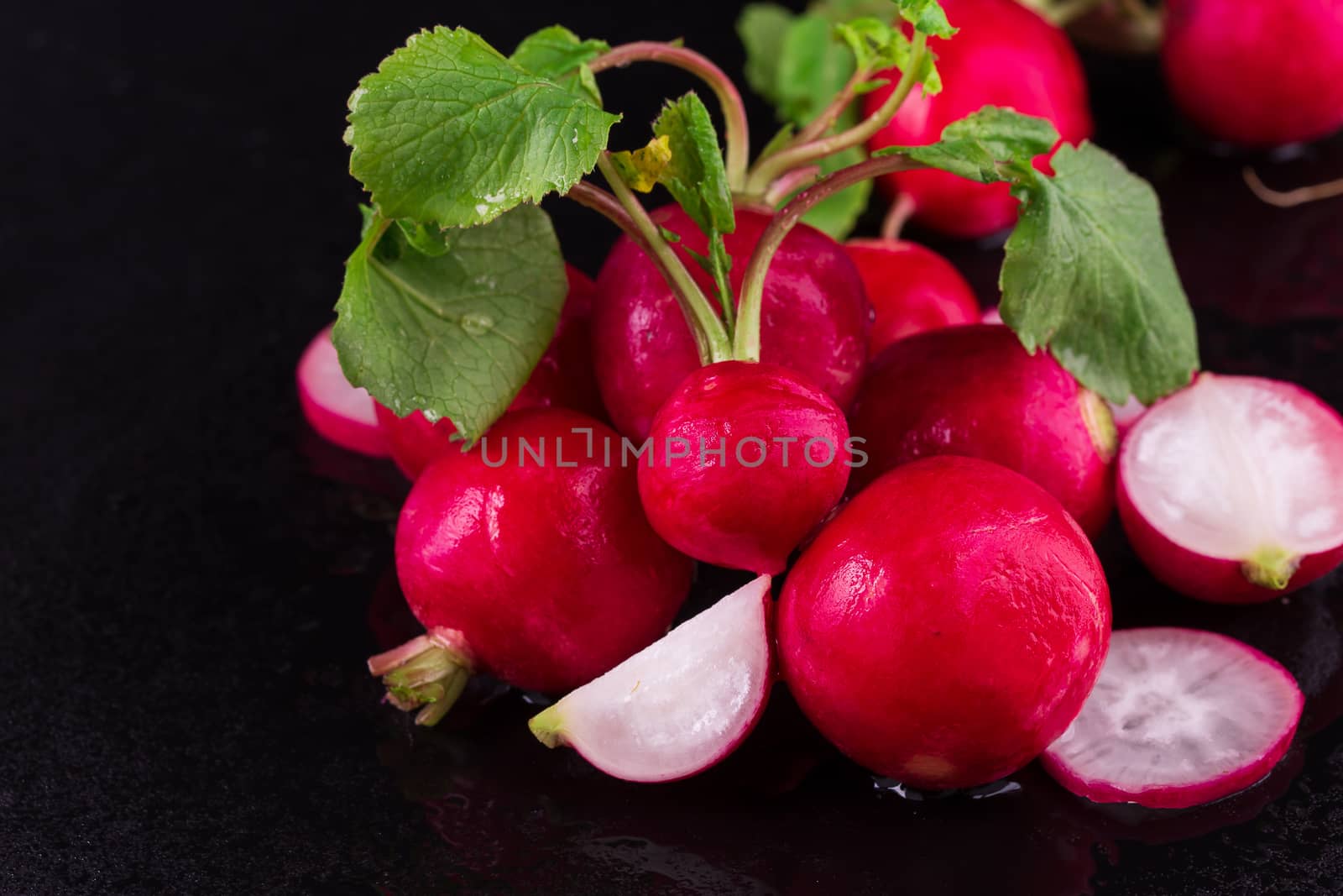 Red fresh radish on wooden