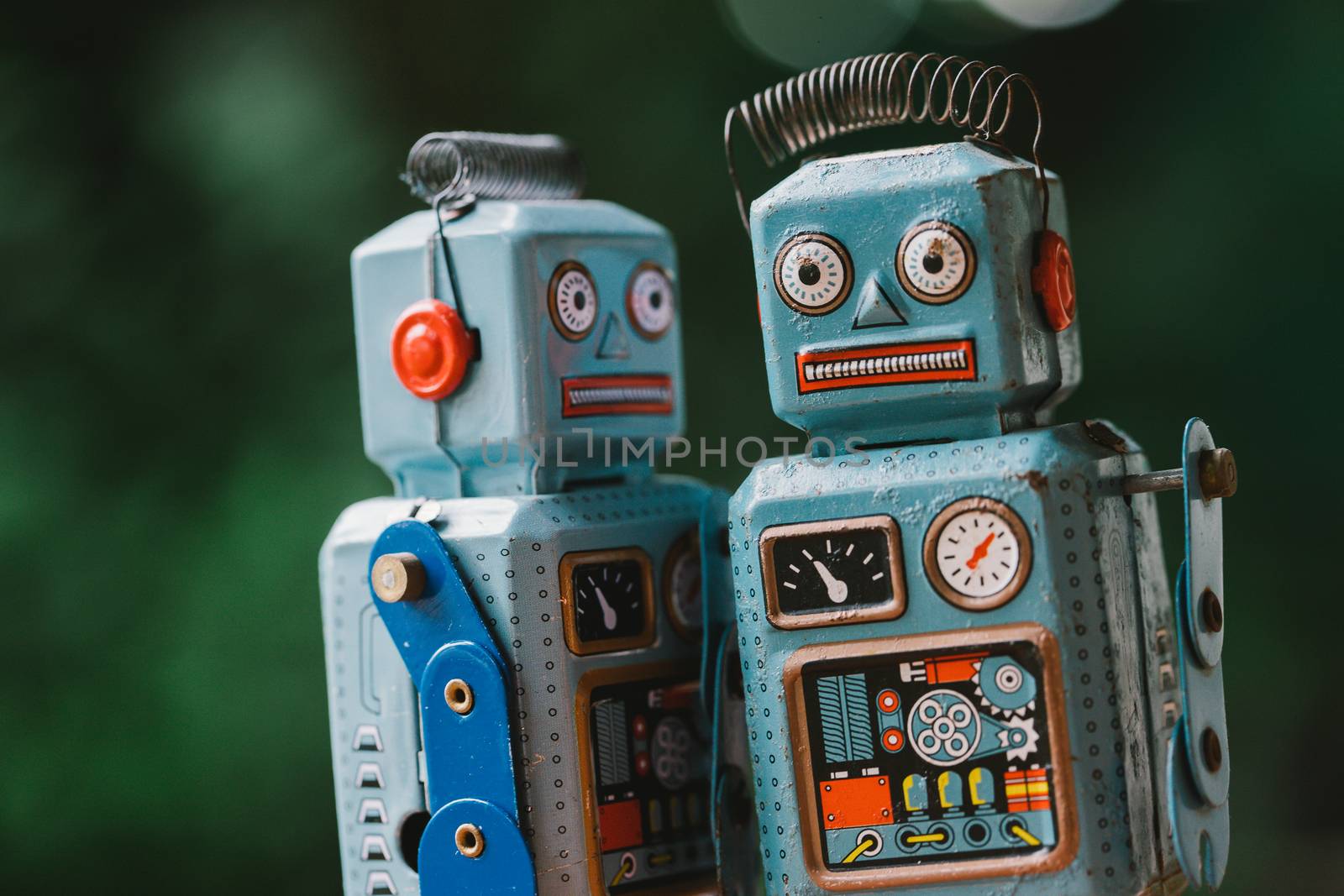 Vintage robot tin toy on yello background