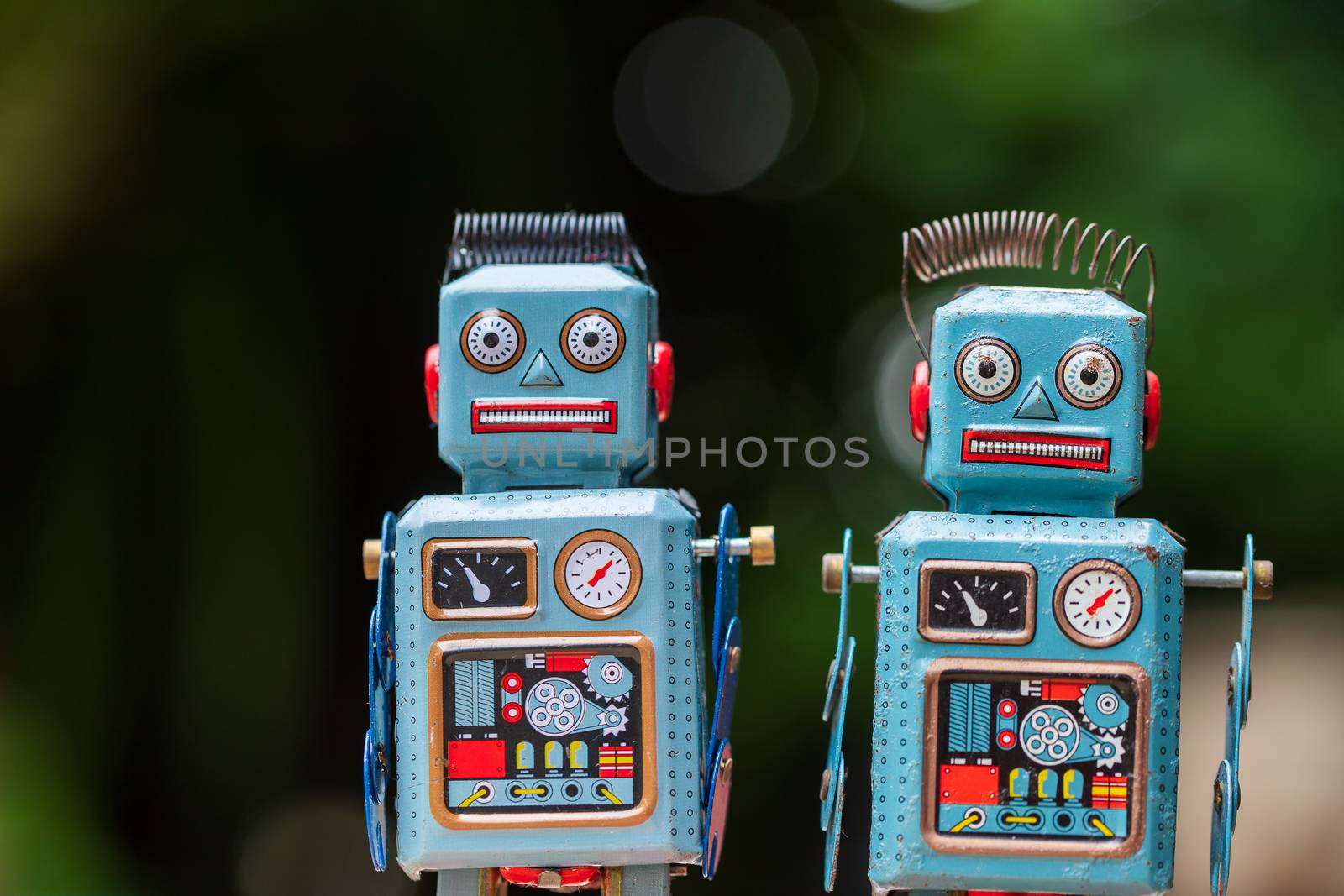 Vintage robot tin toy on yello background