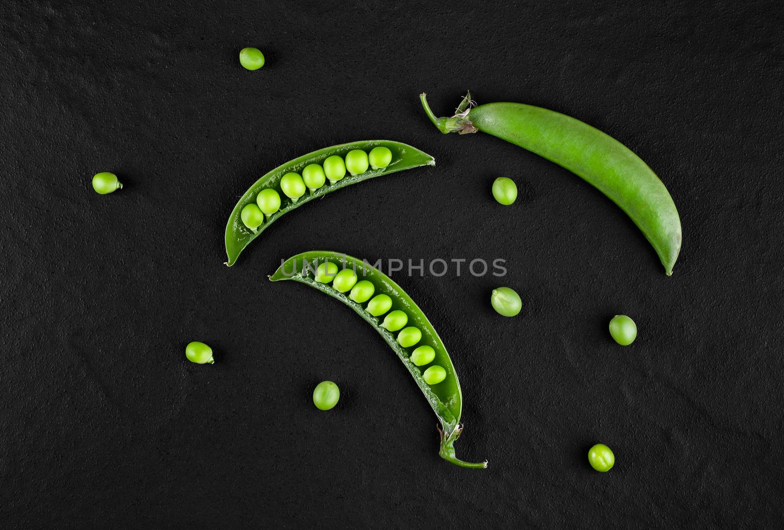 Sugar snap peas with mint on a rustic wood background