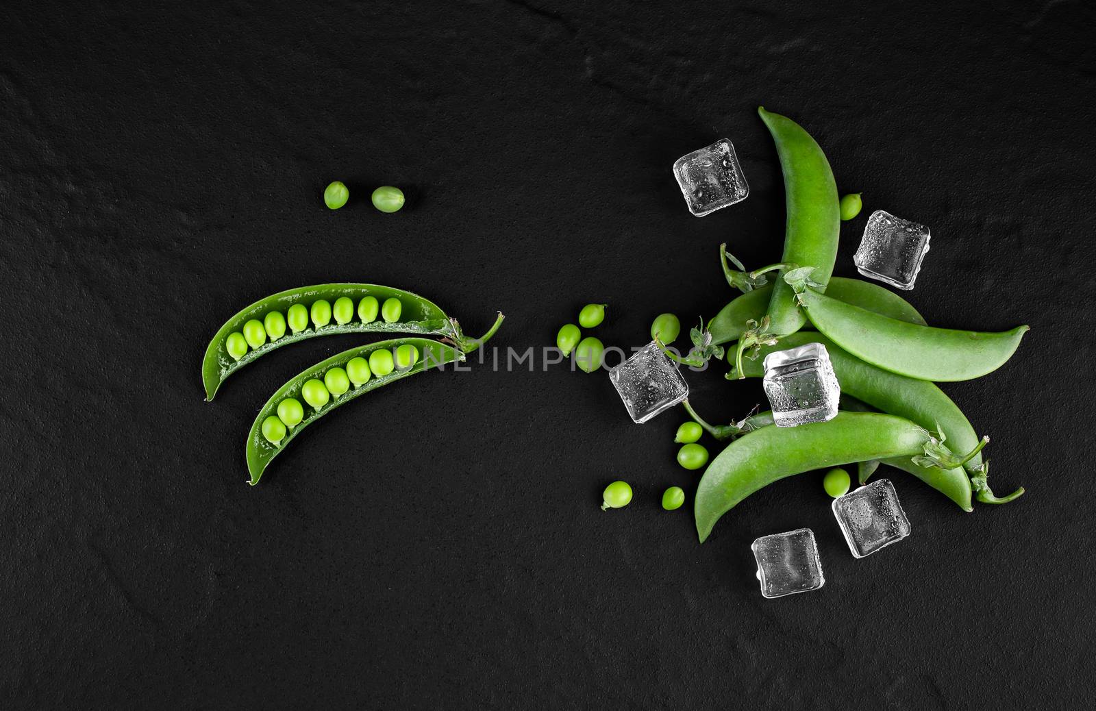 Sugar snap peas with mint on a rustic wood background by freedomnaruk