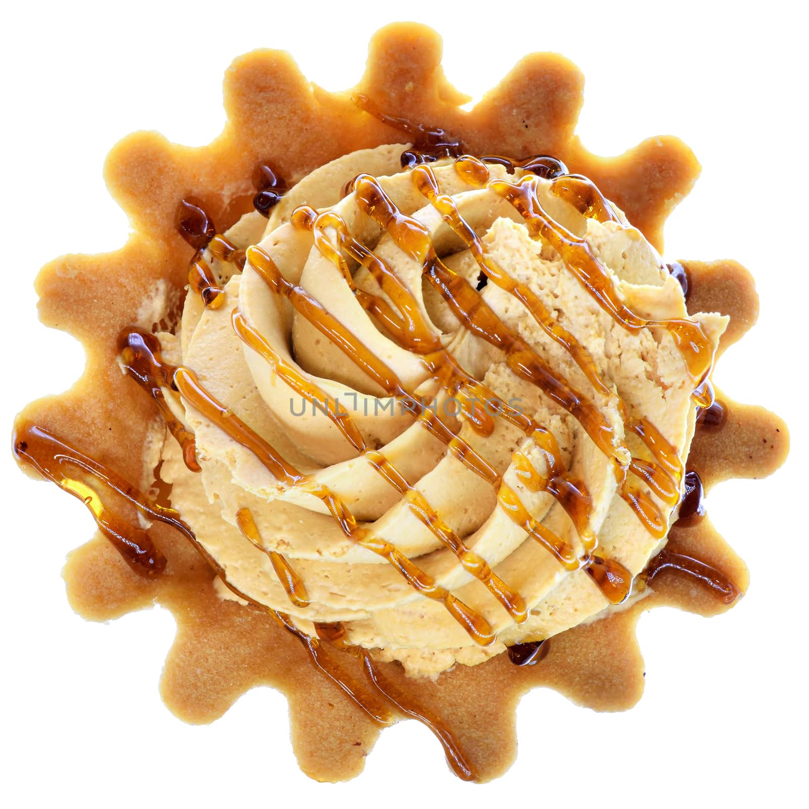 Tartlet cake with cream and caramel, top view isolated on a white background.