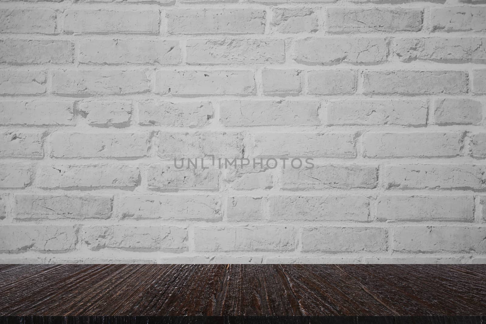 wooden table for montage display product with white brick wall background