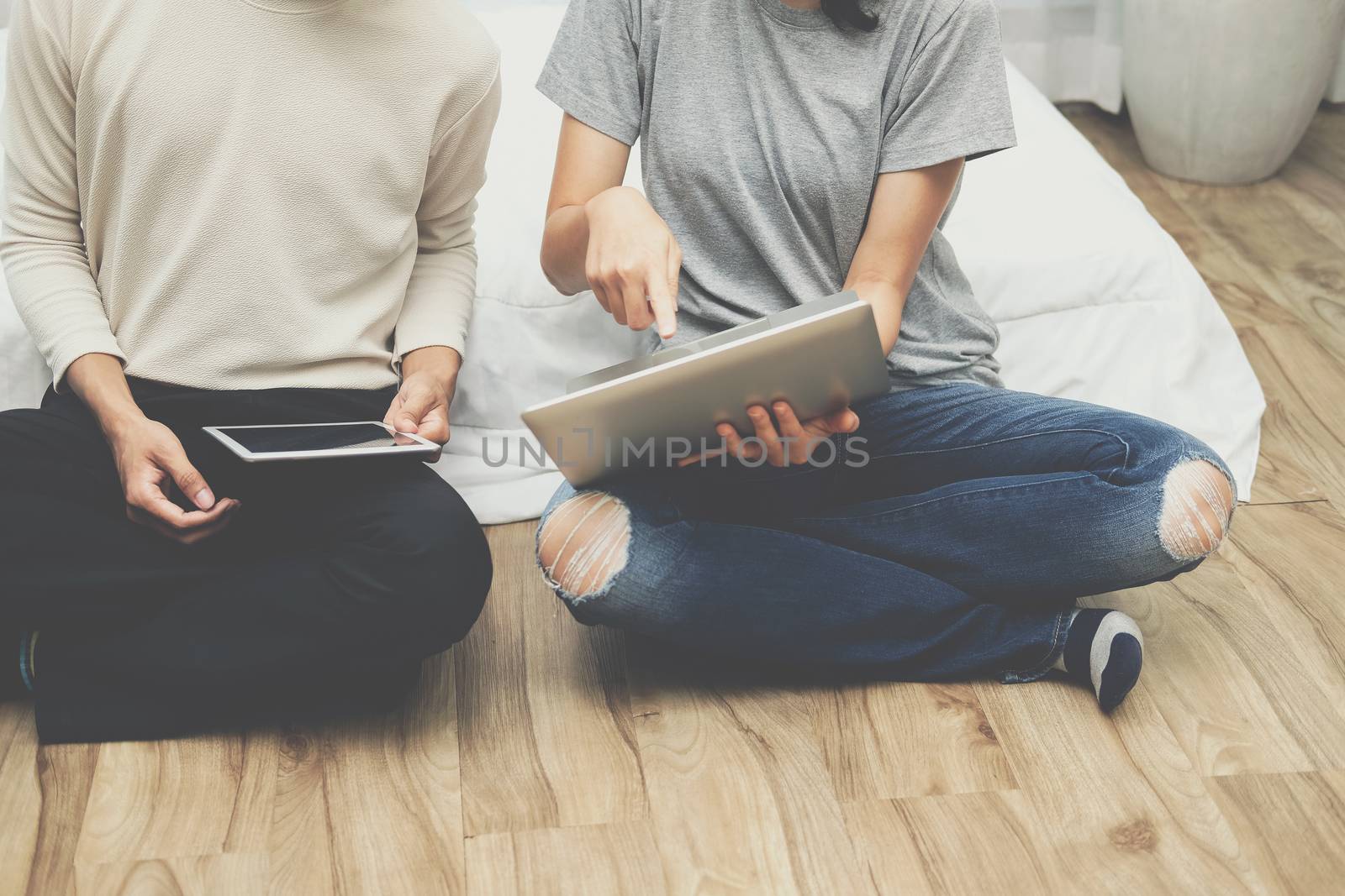 man woman friends using computer tablet. startup teamwork team working together at home