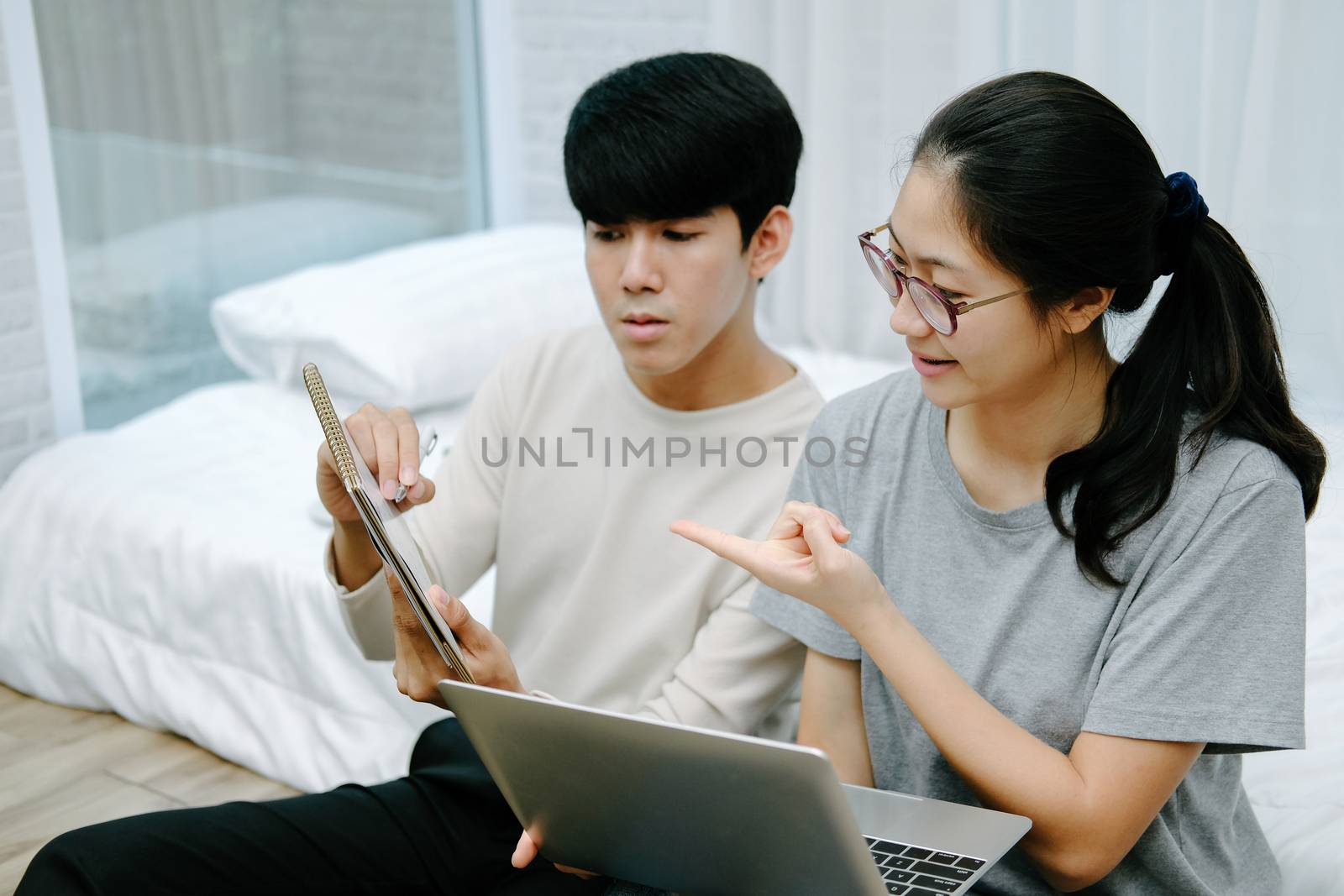 man woman friends discussing plan on calender using computer. startup teamwork team working together at home office