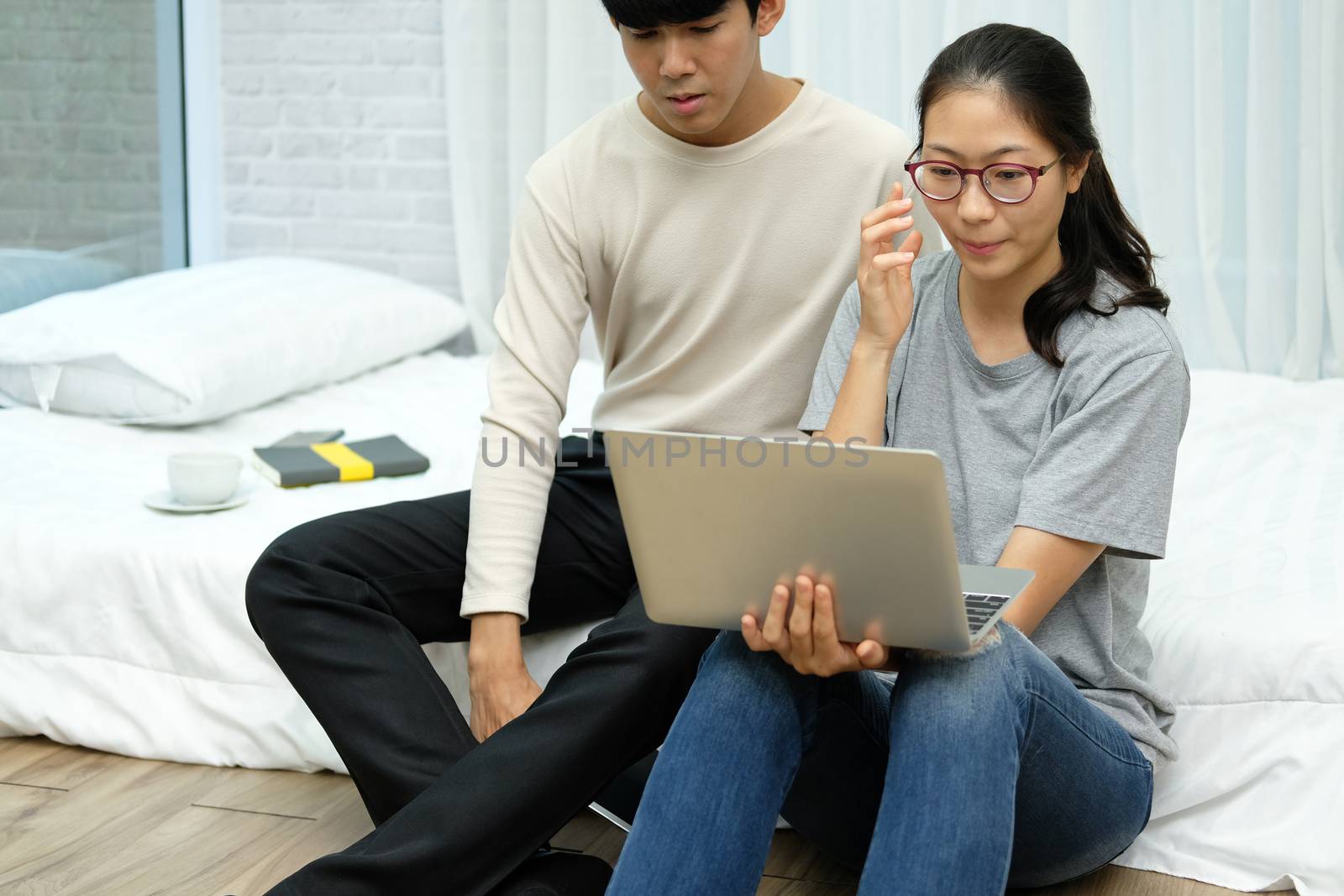 asian woman man talking with colleagues in online video conference meeting. work at home social distancing concept