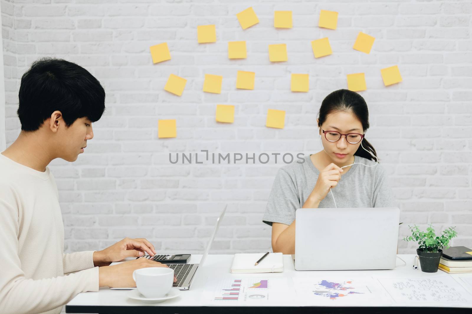 man woman colleagues using computer. startup teamwork coworking team working at home office