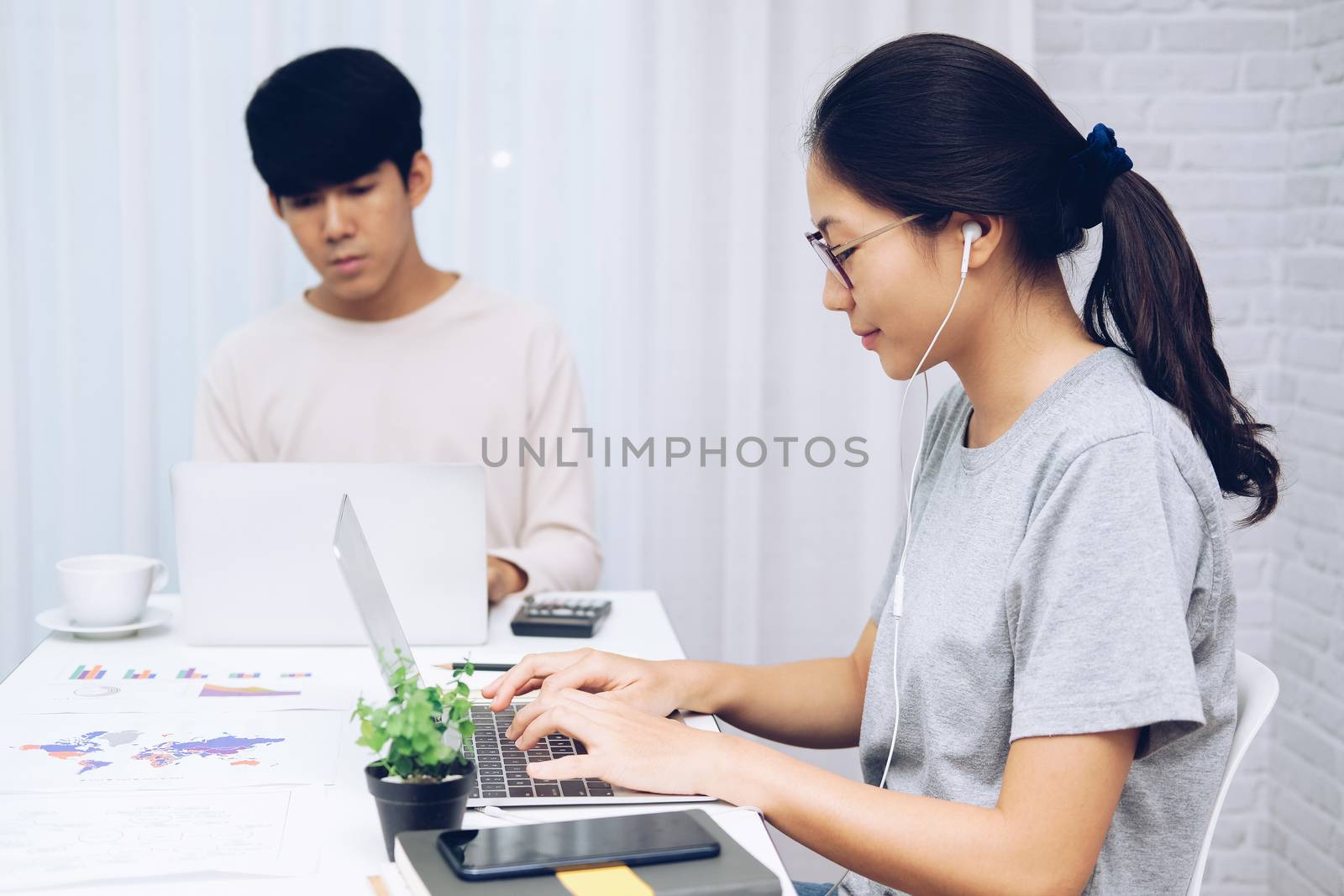 man woman colleagues using computer. startup teamwork coworking team working at home office