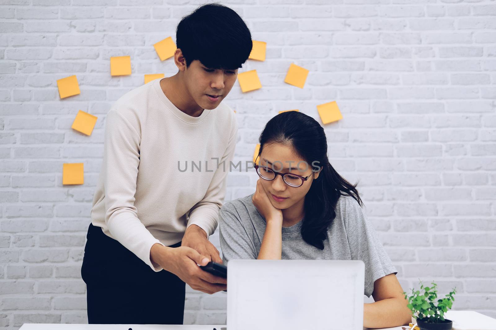 man woman colleagues analyzing data on computer startup teamwork coworking team working at home office