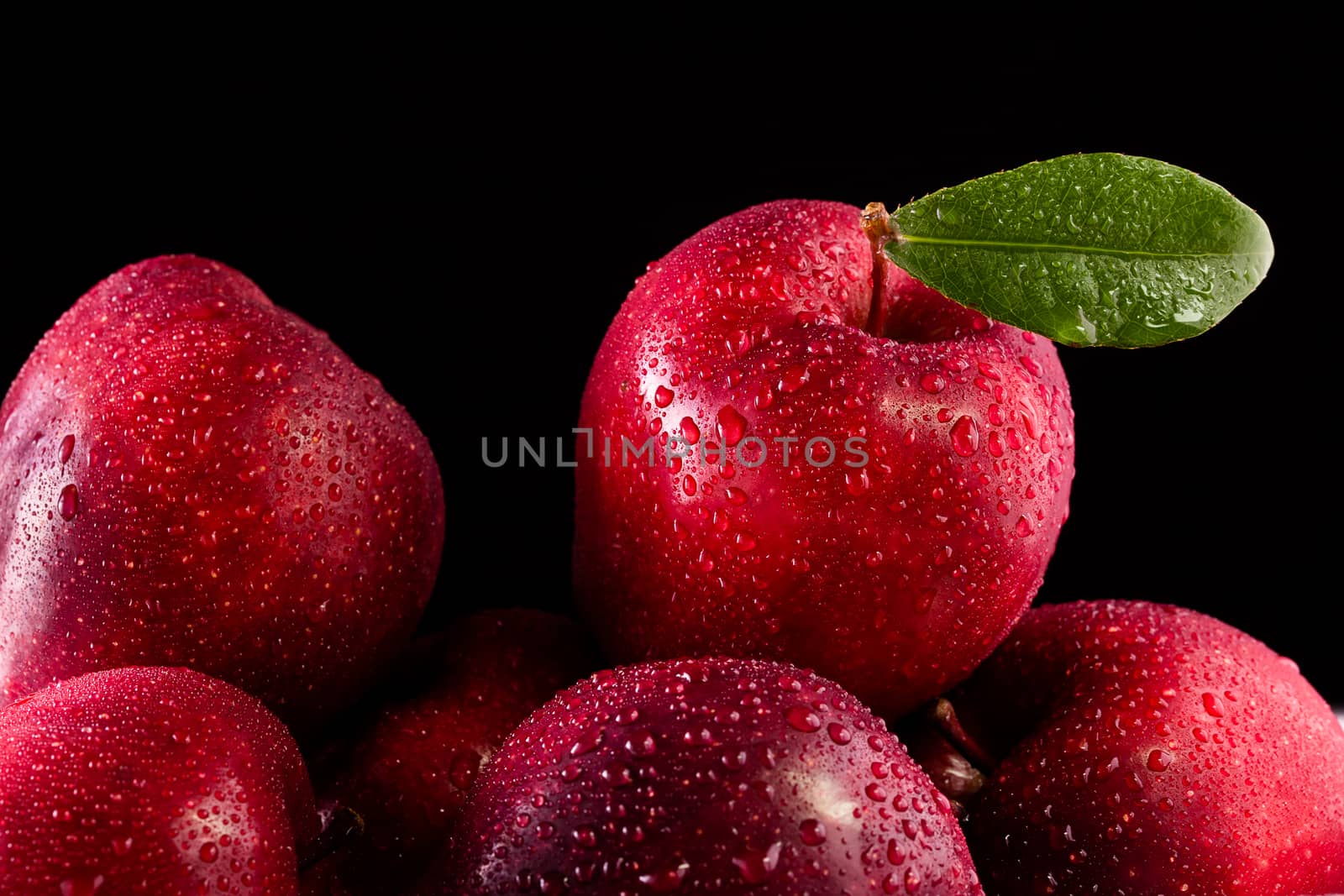 Red apples with leaves on the table by freedomnaruk