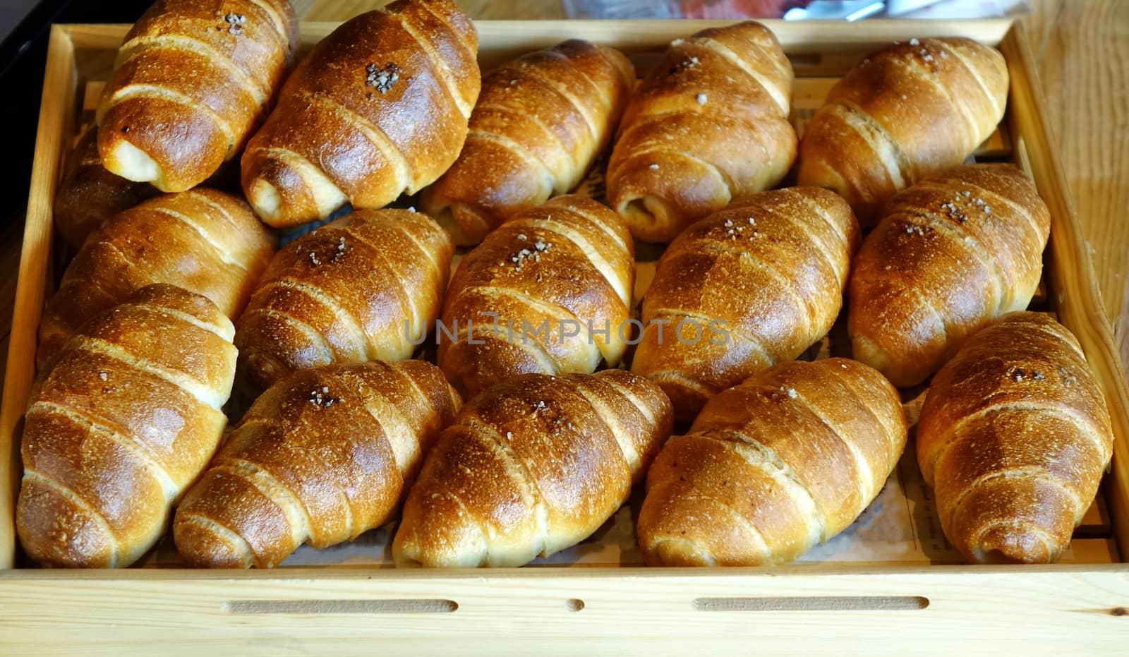 Freshly baked bread buns in a tray