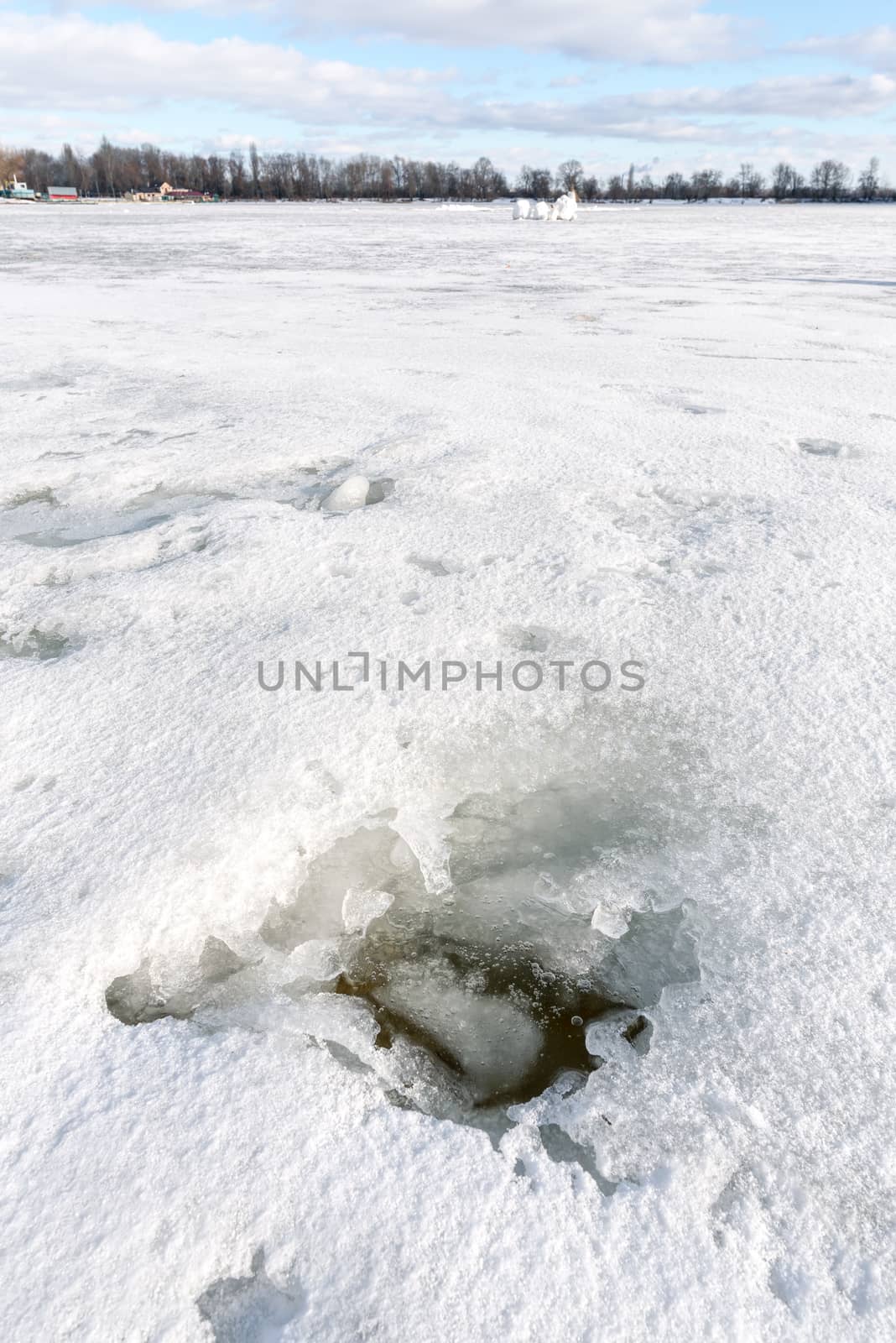 Detail of a hole in the ice on the frozen Dnieper river in Kiev, Ukraine