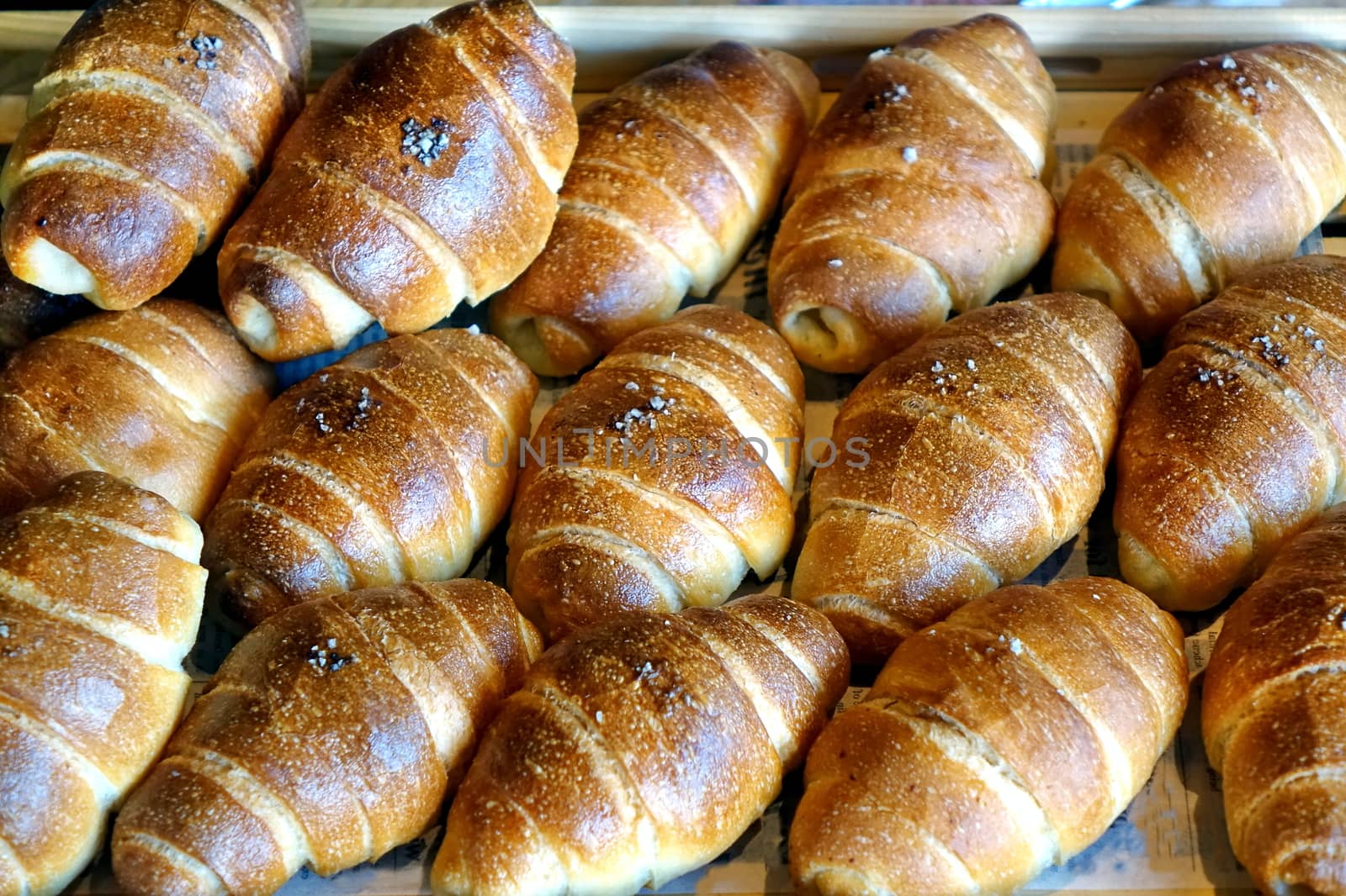 Freshly baked bread buns in a tray