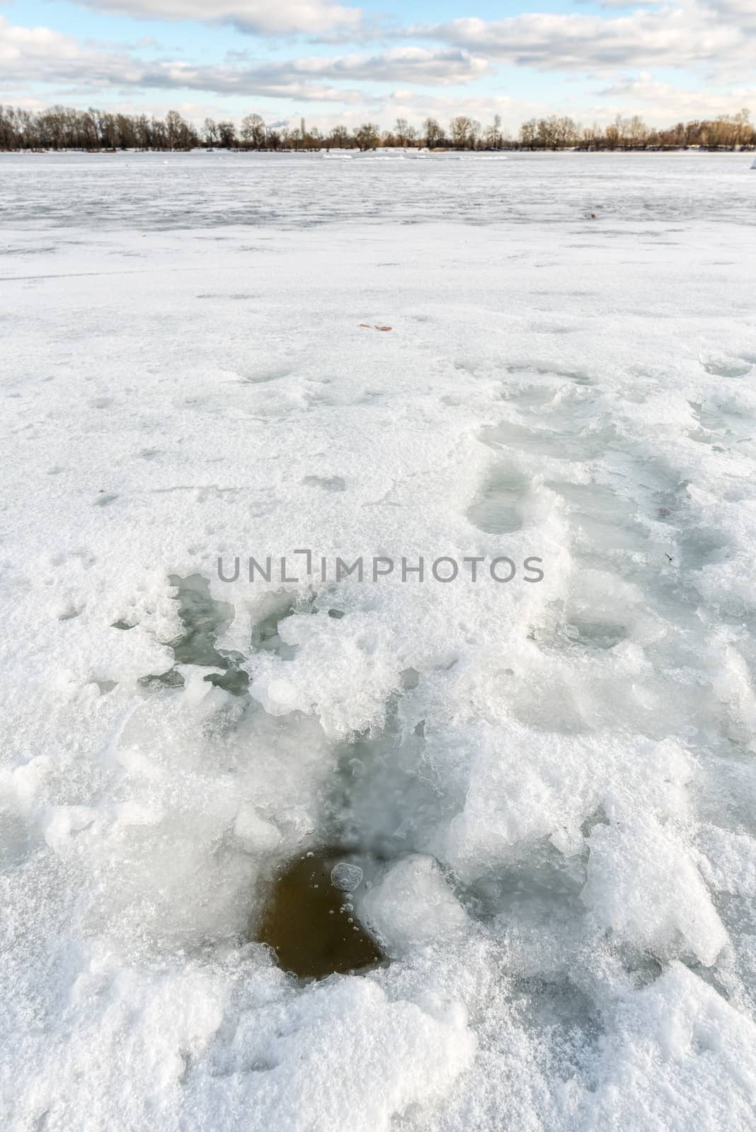 Detail of a hole in the ice on the frozen Dnieper river in Kiev, Ukraine