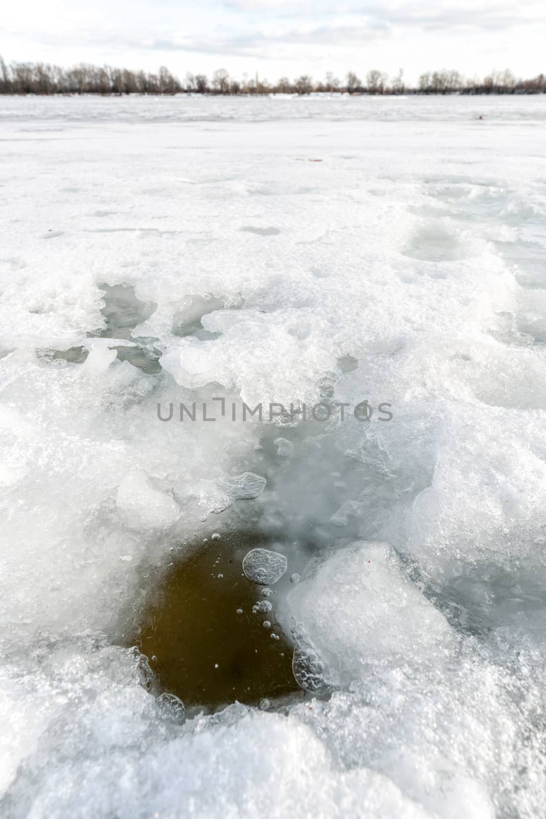 Detail of a hole in the ice on the frozen Dnieper river in Kiev, Ukraine