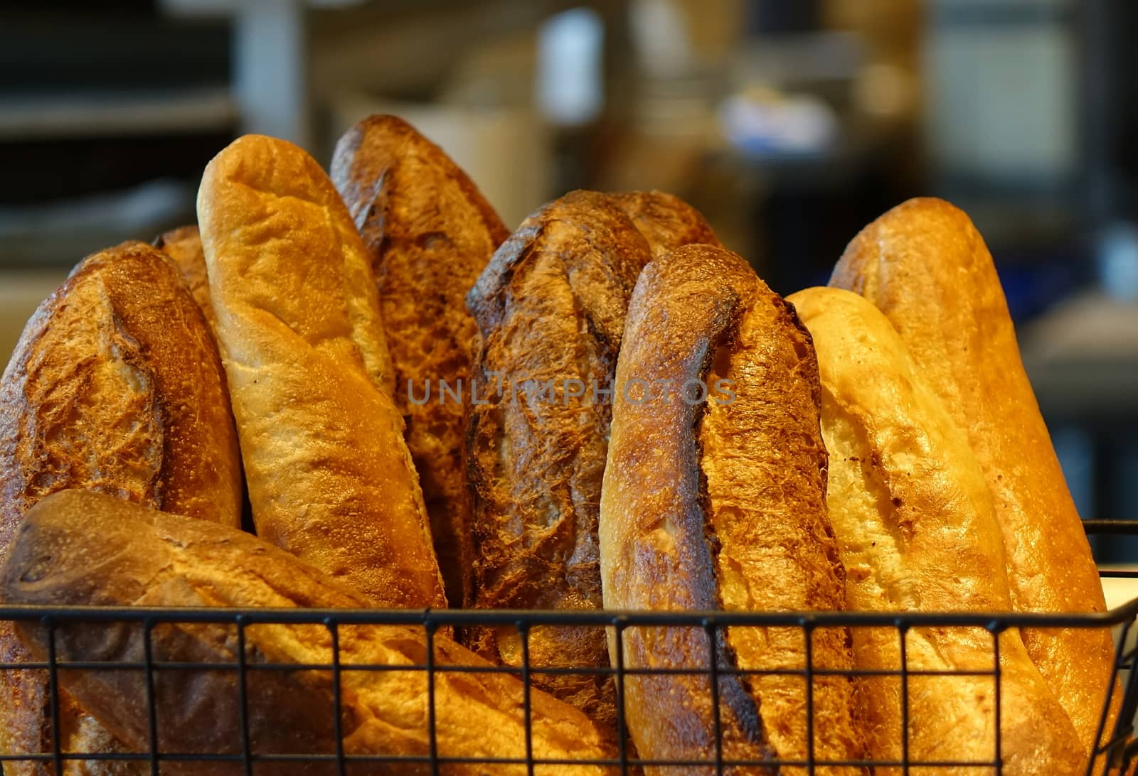 Freshly baked loaves of French bread in a basket
