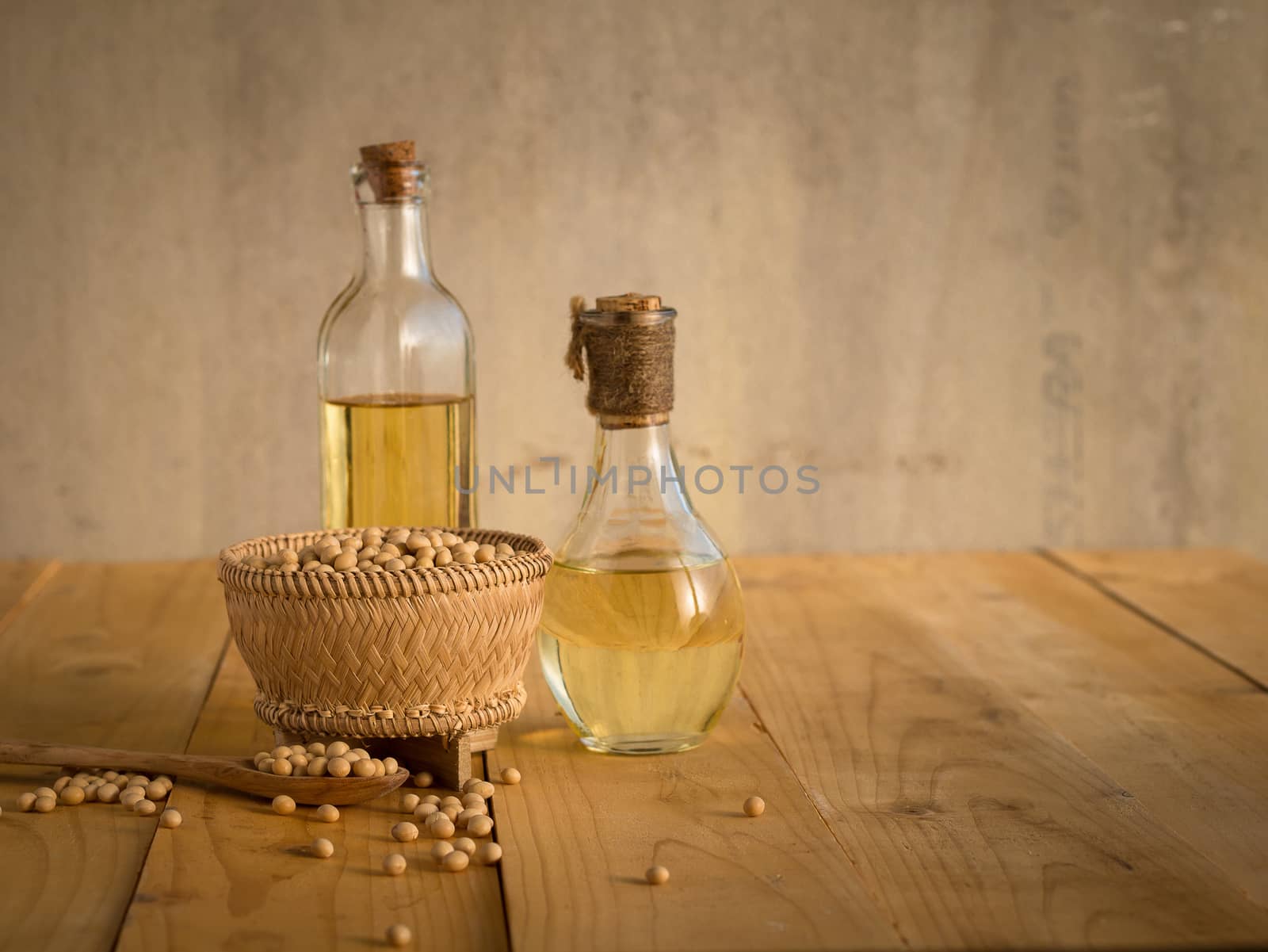 Soy bean and soy oil on a wooden table by kaiskynet