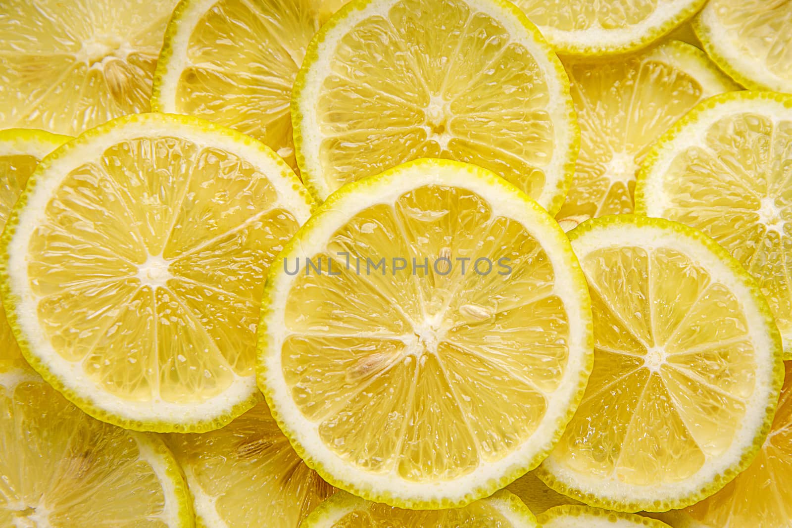 Lemon background. Top view of round slices