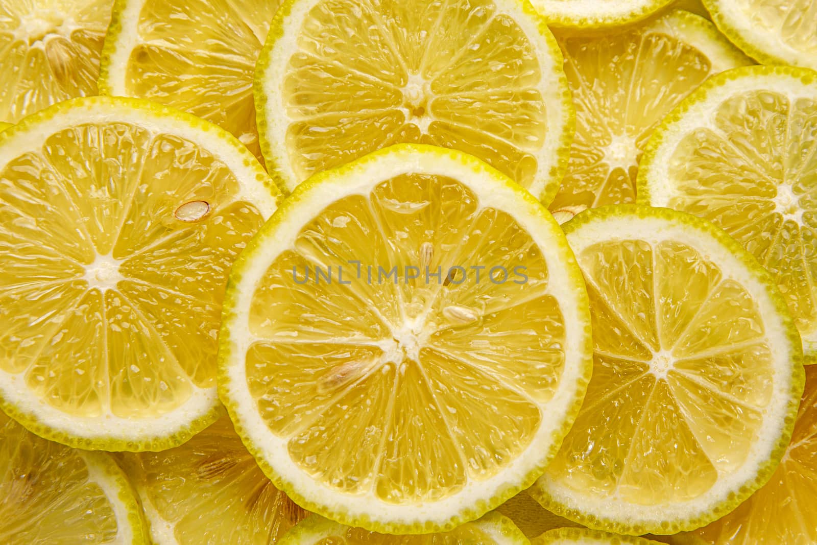 Lemon background. Top view of round slices