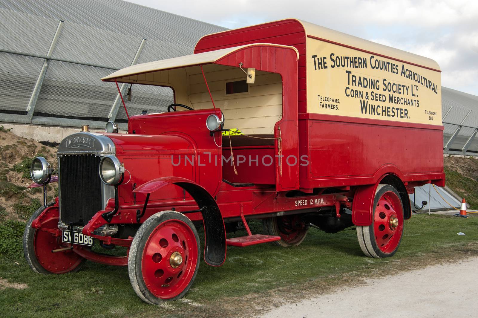 Basingstoke, UK - October 16, 2011: A vintage Thornycroft J Type Lorry dating from 1917 painted with the livery of the Southern Counties Agricultural Trading Societies or SCATS.  On public display at at transport fair in Basingstoke, Hampshire - the town where it was originally made.
